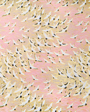 Japanese chiyogami paper featuring white flying cranes in a zigzag formation on a light pink background with metallic gold details.