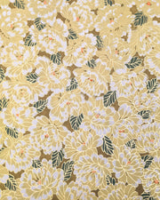 Japanese chiyogami paper featuring large yellow chrysanthemums with green leaves on a brown background with metallic gold details.