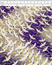 Japanese chiyogami paper featuring white flying cranes in a zigzag formation on a dark purple background with metallic gold details.