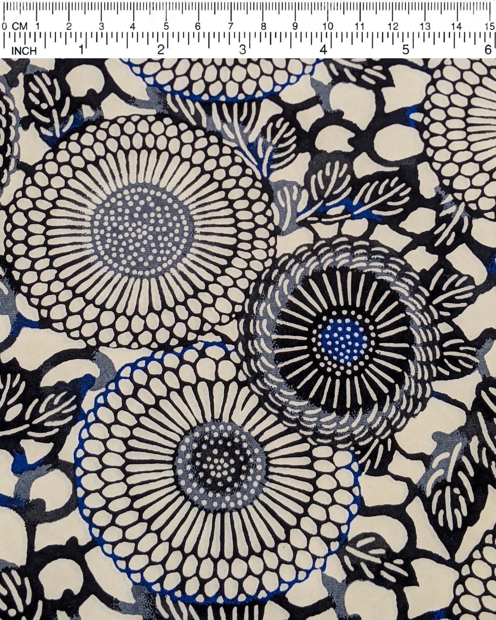 Japanese chiyogami paper featuring large black and gray zinnia flowers with small blue details on a cream background.