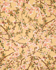 Japanese chiyogami paper featuring pink and white plum blossoms with dark brown branches and green leaves on a beige background with metallic gold details.
