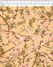 Japanese chiyogami paper featuring pink and white plum blossoms with dark brown branches and green leaves on a beige background with metallic gold details.