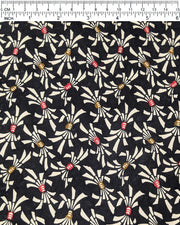 Japanese chiyogami paper featuring cream colored Japanese noshi ribbons with red and brown centers on a black background.