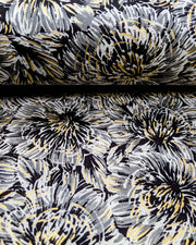 Japanese chiyogami paper featuring large black and gray chrysanthemums on a black background with metallic gold details.