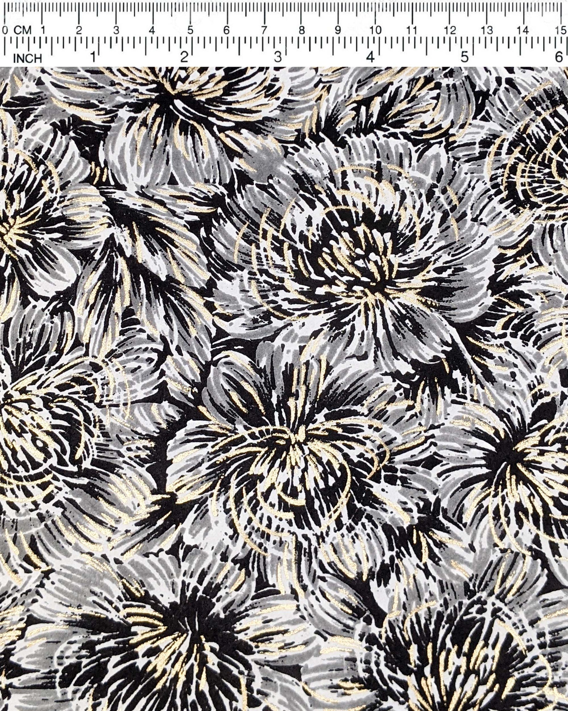 Japanese chiyogami paper featuring large black and gray chrysanthemums on a black background with metallic gold details.