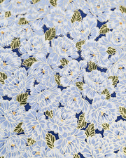 Japanese chiyogami paper featuring large light blue chrysanthemums with green leaves on a dark blue background with metallic gold details.