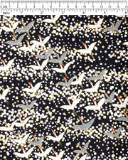 Japanese chiyogami paper featuring flying white and gray cranes with red heads on a black background with metallic gold and silver details.