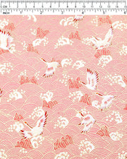 Japanese chiyogami paper featuring white and pink cranes flying over a pink wave background with metallic gold details.