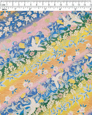 Japanese chiyogami paper featuring white cranes and a variety of flowers on a striped background in blue, pink, green, yellow, and orange with metallic gold details.