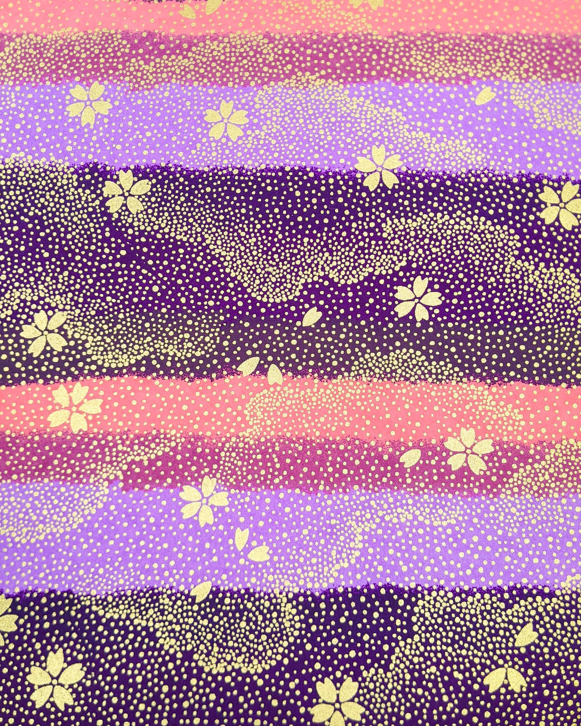 Japanese chiyogami paper featuring gold cherry blossoms on a purple and pink striped background with metallic gold details.