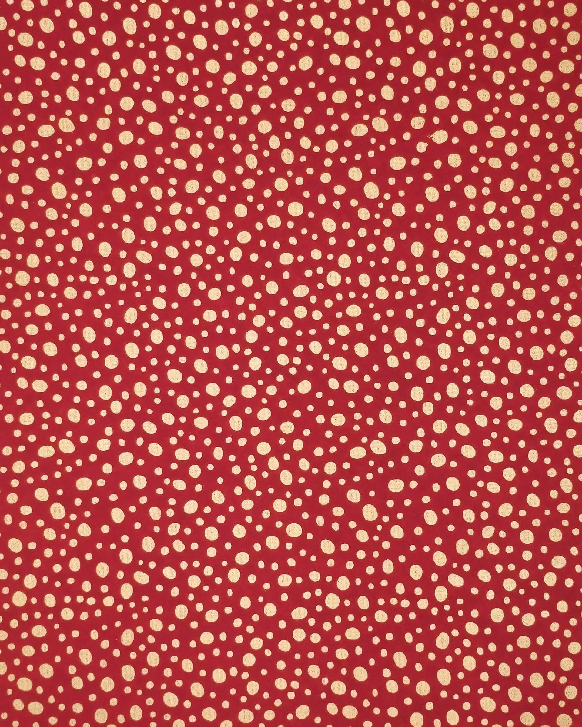 Japanese chiyogami paper featuring metallic gold abstract dots on a red background.
