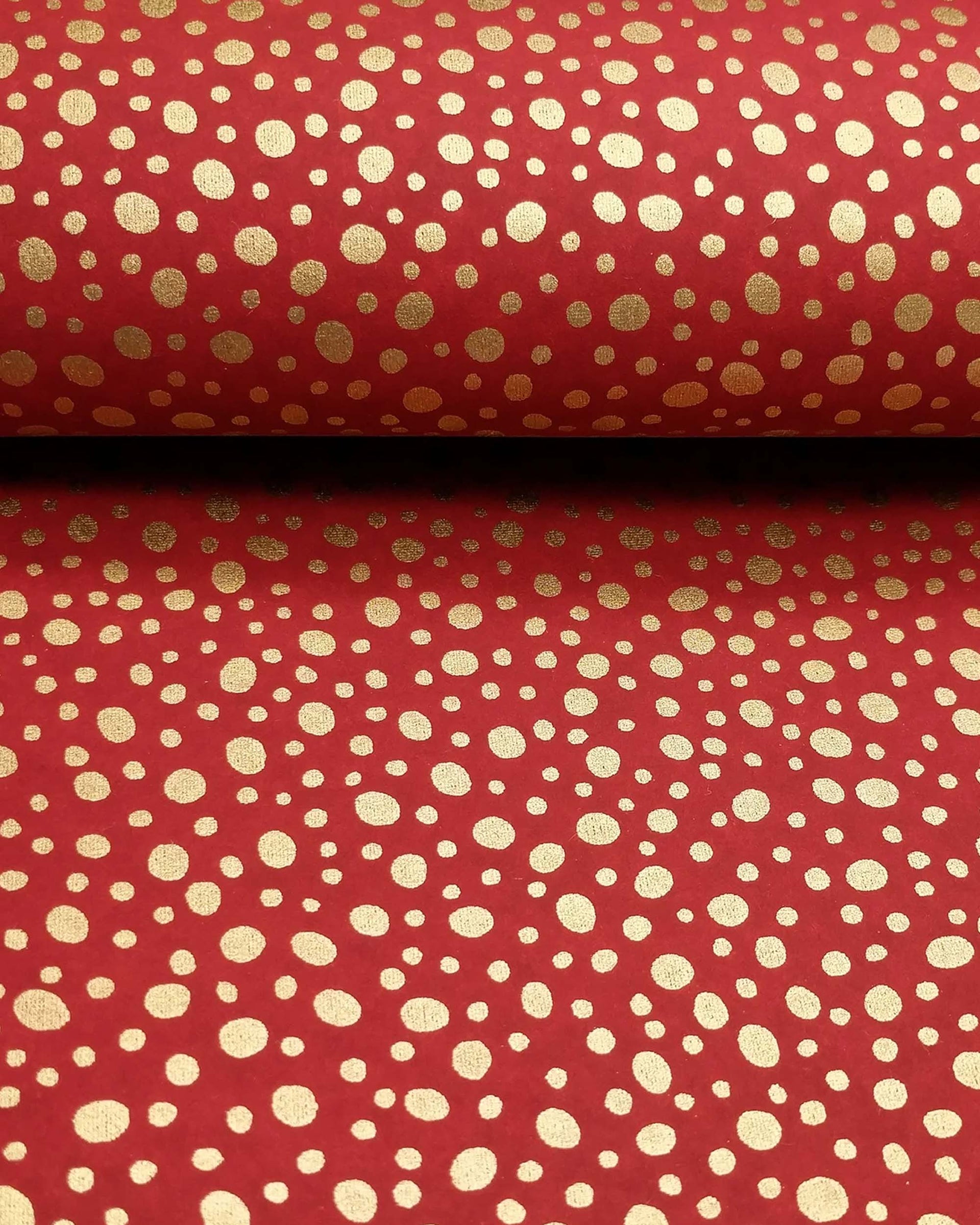 Japanese chiyogami paper featuring metallic gold abstract dots on a red background.