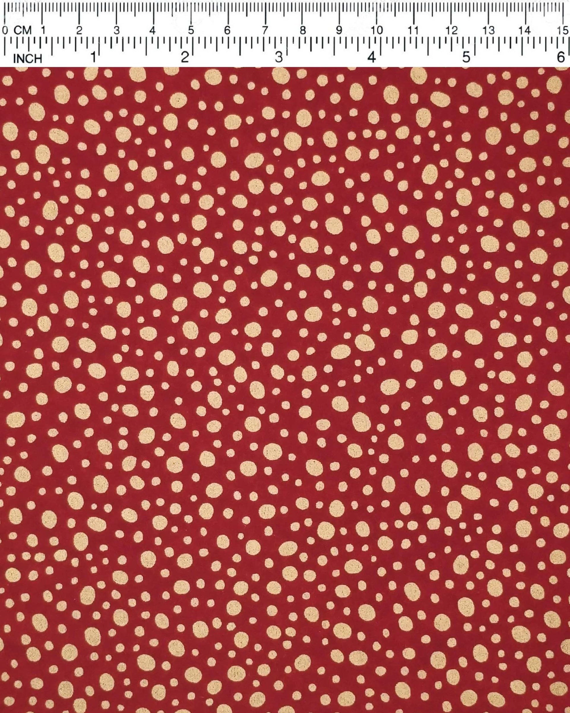 Japanese chiyogami paper featuring metallic gold abstract dots on a red background.