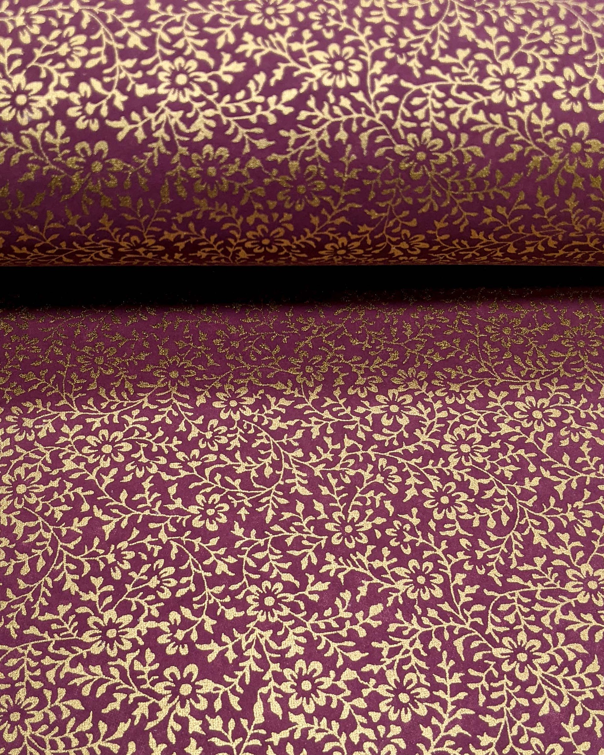 Japanese chiyogami paper featuring a metallic gold floral motif on a purple background.
