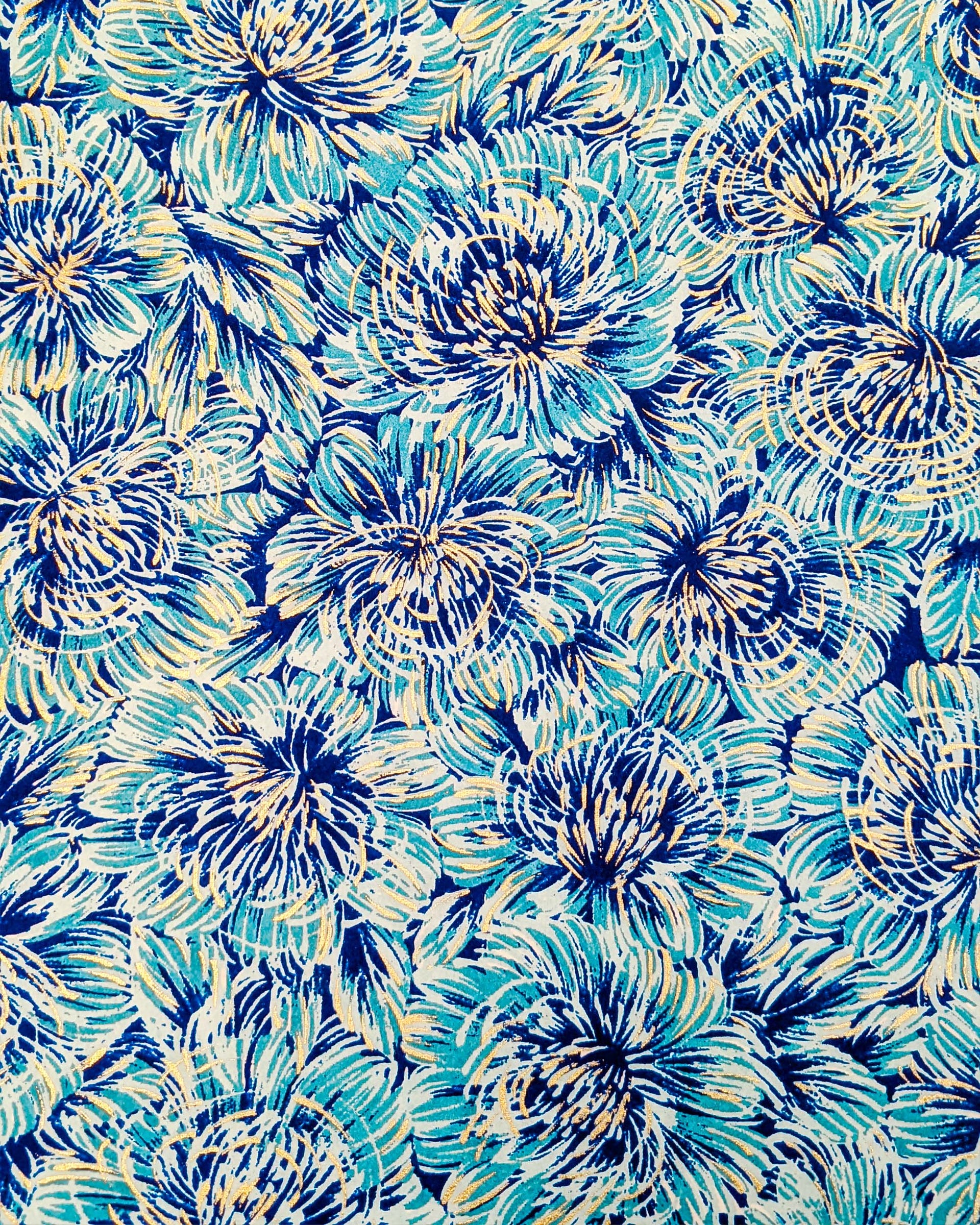 Japanese chiyogami paper featuring large blue chrysanthemums on a dark blue background with metallic gold details.