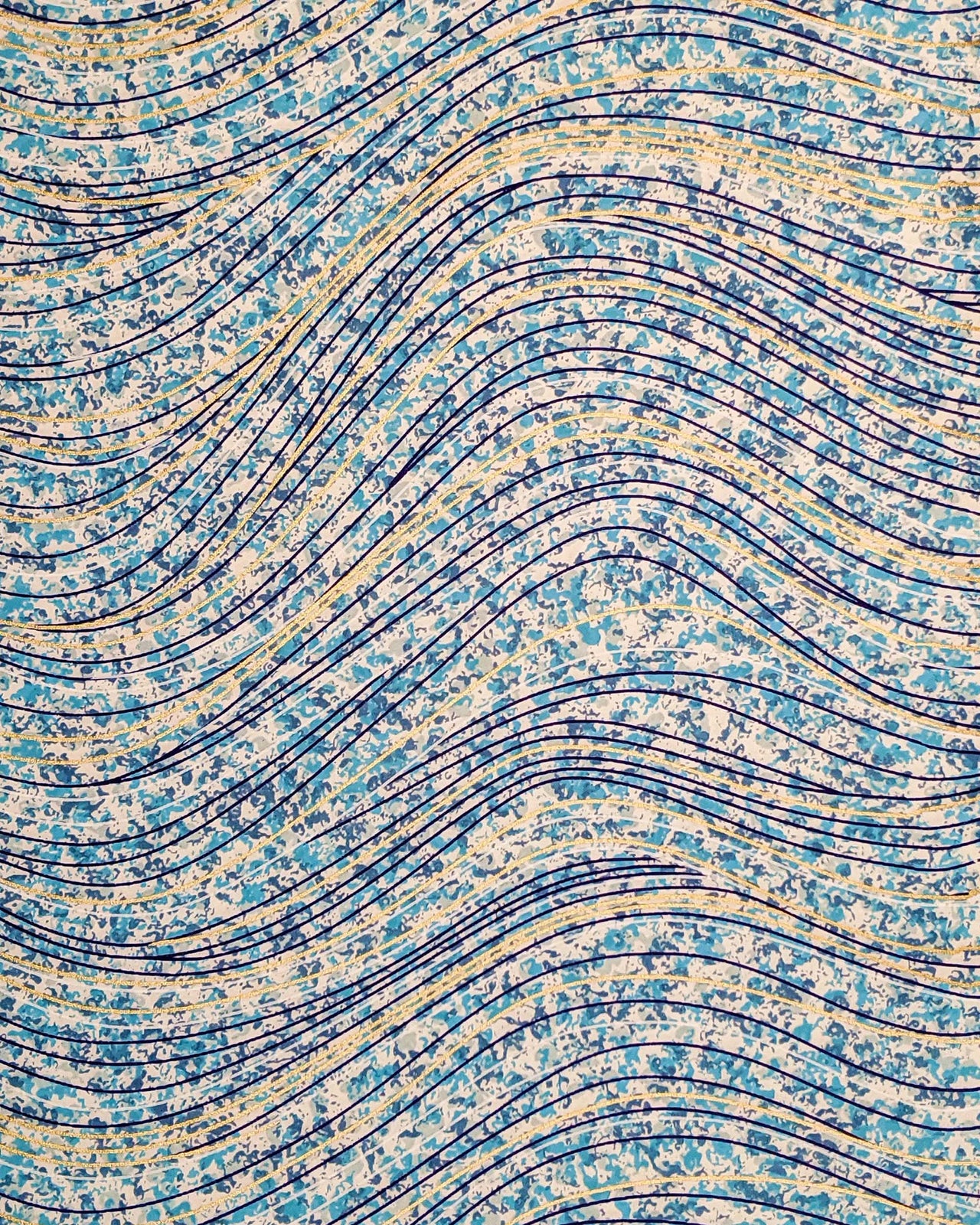 Japanese chiyogami paper featuring metallic gold and dark blue swirls on a light blue and white speckled background.