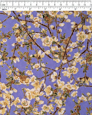 Japanese chiyogami paper featuring beige and white plum blossoms with dark brown branches and green leaves on a purple background with metallic gold details.