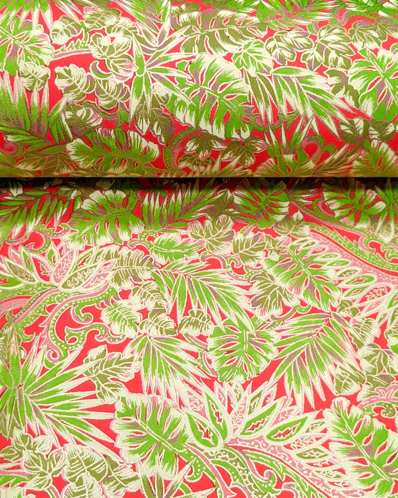 Japanese chiyogami paper featuring green and pink frond leaves on a red background with metallic gold details.