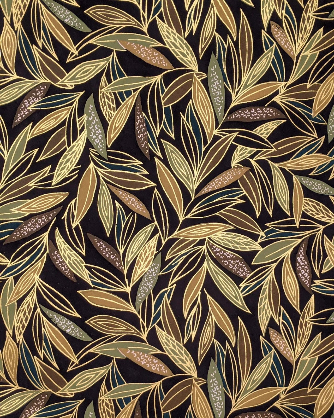 Japanese chiyogami paper featuring thin brown and green leaves on a black background with metallic gold details.