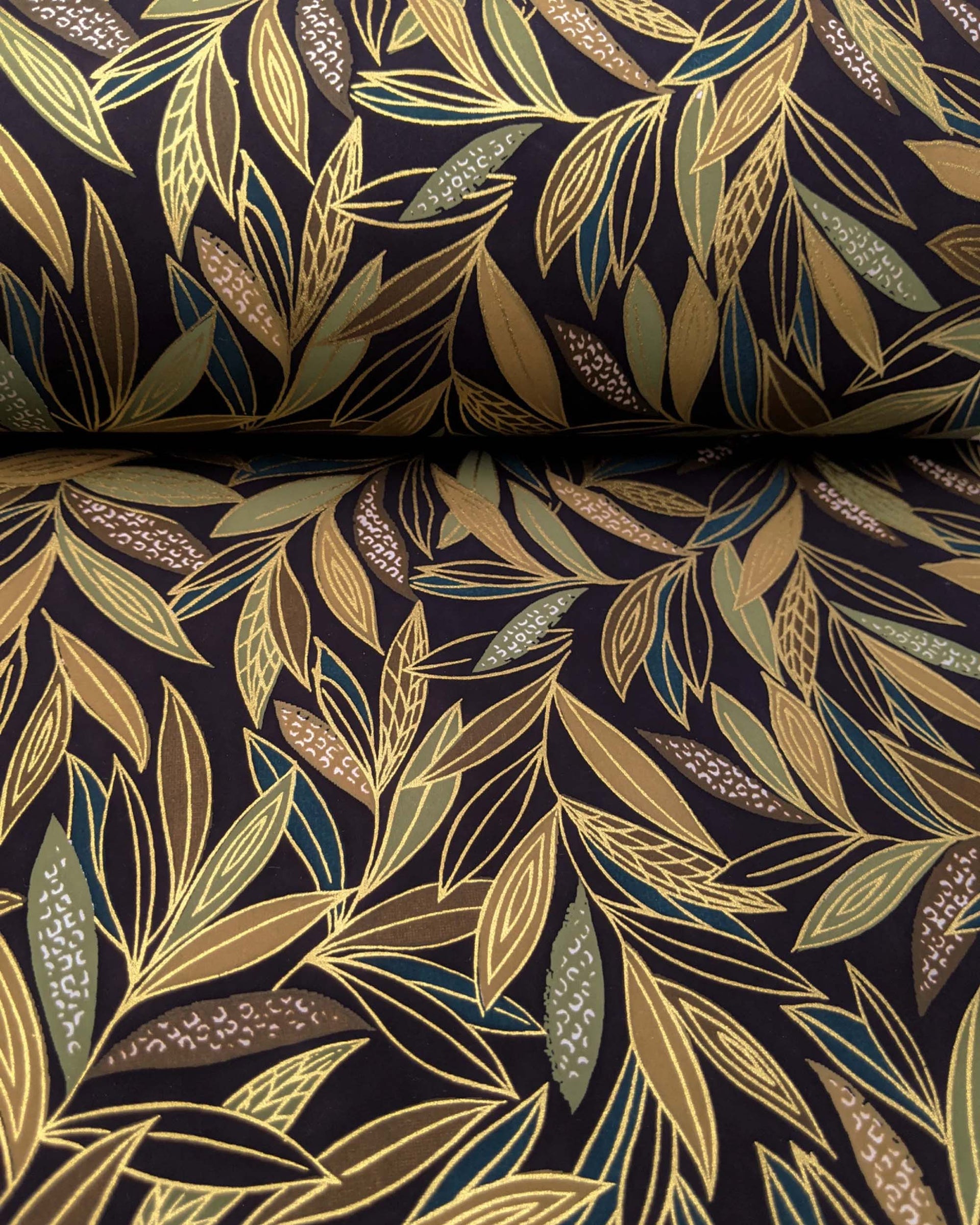 Japanese chiyogami paper featuring thin brown and green leaves on a black background with metallic gold details.