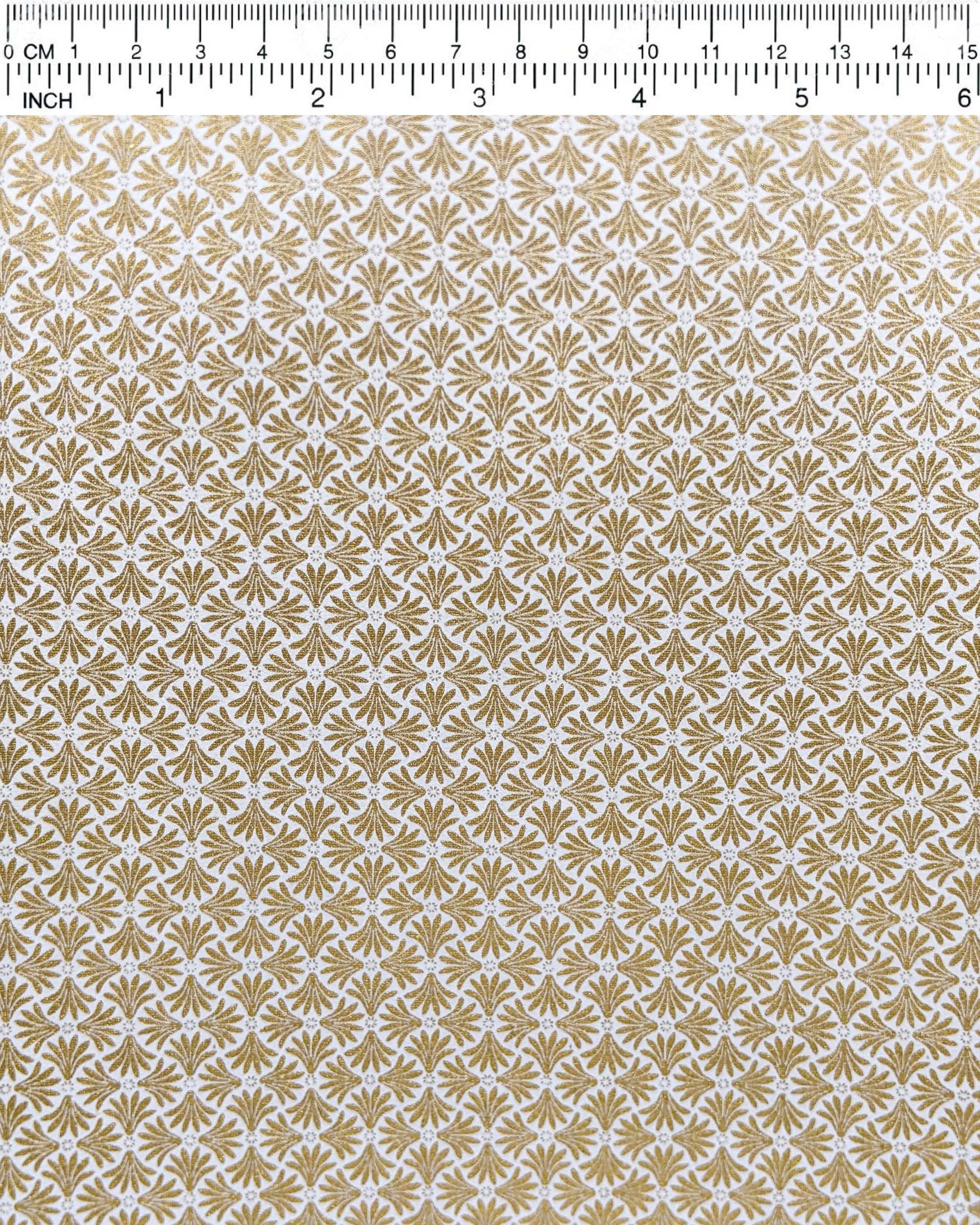 Japanese chiyogami paper featuring metallic gold geometric stylized flowers on a white background.