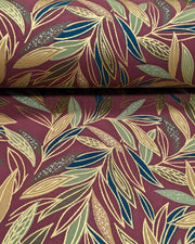 Japanese chiyogami paper featuring thin brown and green leaves on a brown background with metallic gold details.