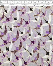 Japanese chiyogami paper featuring purple, black, and white flying cranes on a gray background with metallic gold details.