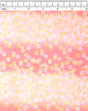 Japanese chiyogami paper featuring metallic gold and white round blossoms on a pink gradient background.