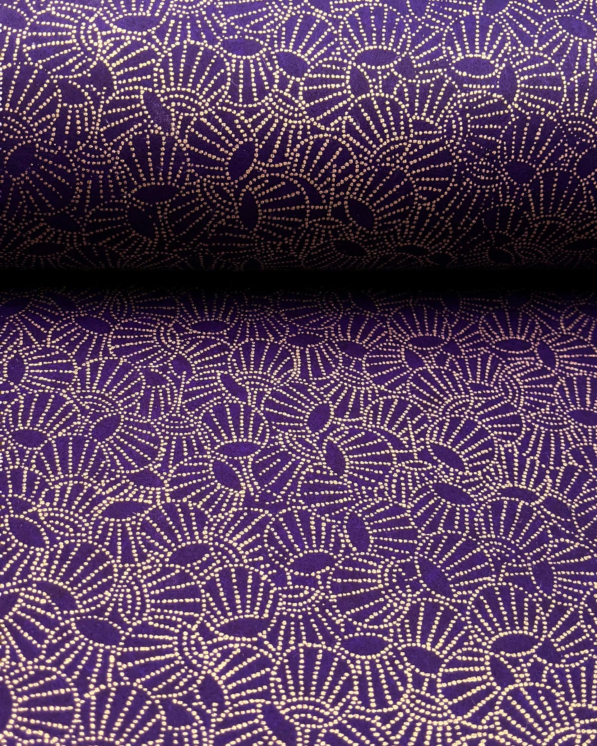 Japanese chiyogami paper featuring metallic gold dotted temari balls on a purple background.