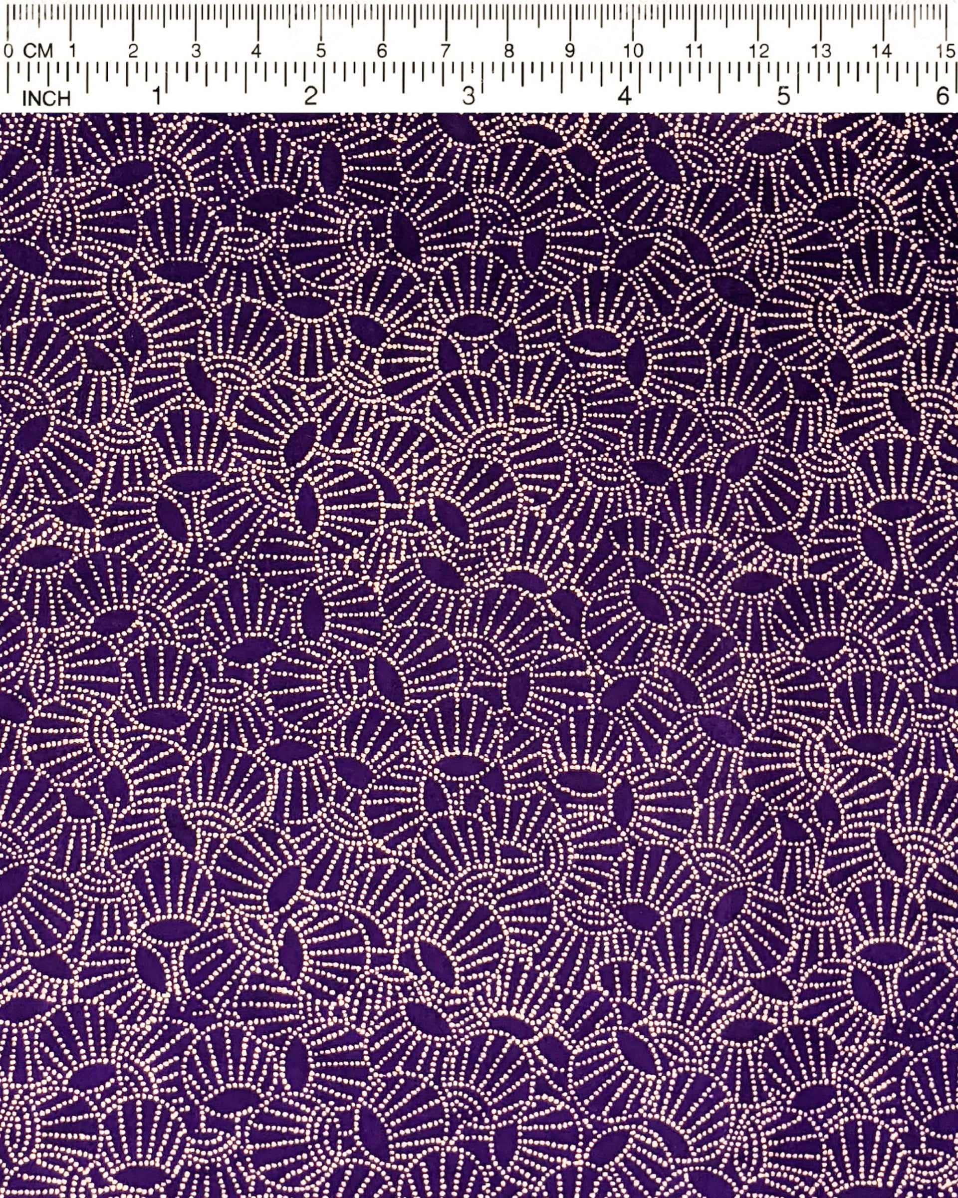 Japanese chiyogami paper featuring metallic gold dotted temari balls on a purple background.