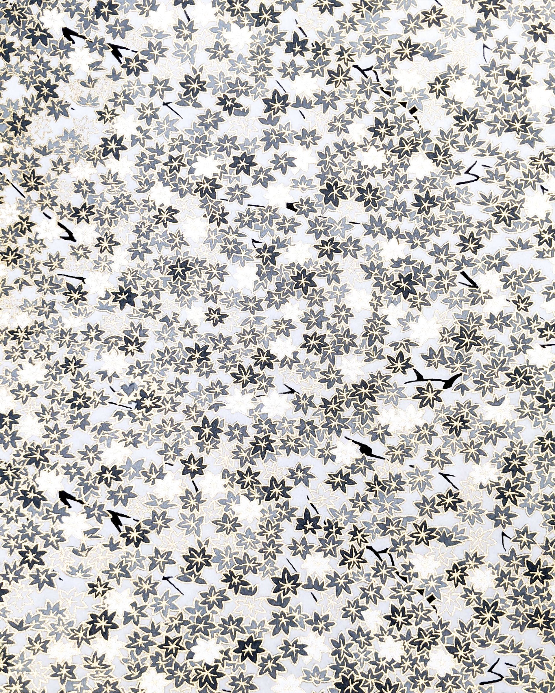 Japanese chiyogami paper featuring small gray and white momiji (maple leaves) on a light gray background with metallic gold details.