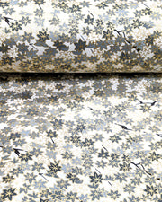 Japanese chiyogami paper featuring small gray and white momiji (maple leaves) on a light gray background with metallic gold details.