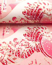 Japanese chiyogami paper featuring a pink version of the famous painting "The Great Wave Off Kanagawa" by Katsushika Hokusai with metallic gold details.