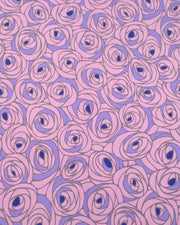 Japanese chiyogami paper featuring large purple rose buds with a dark blue center. 