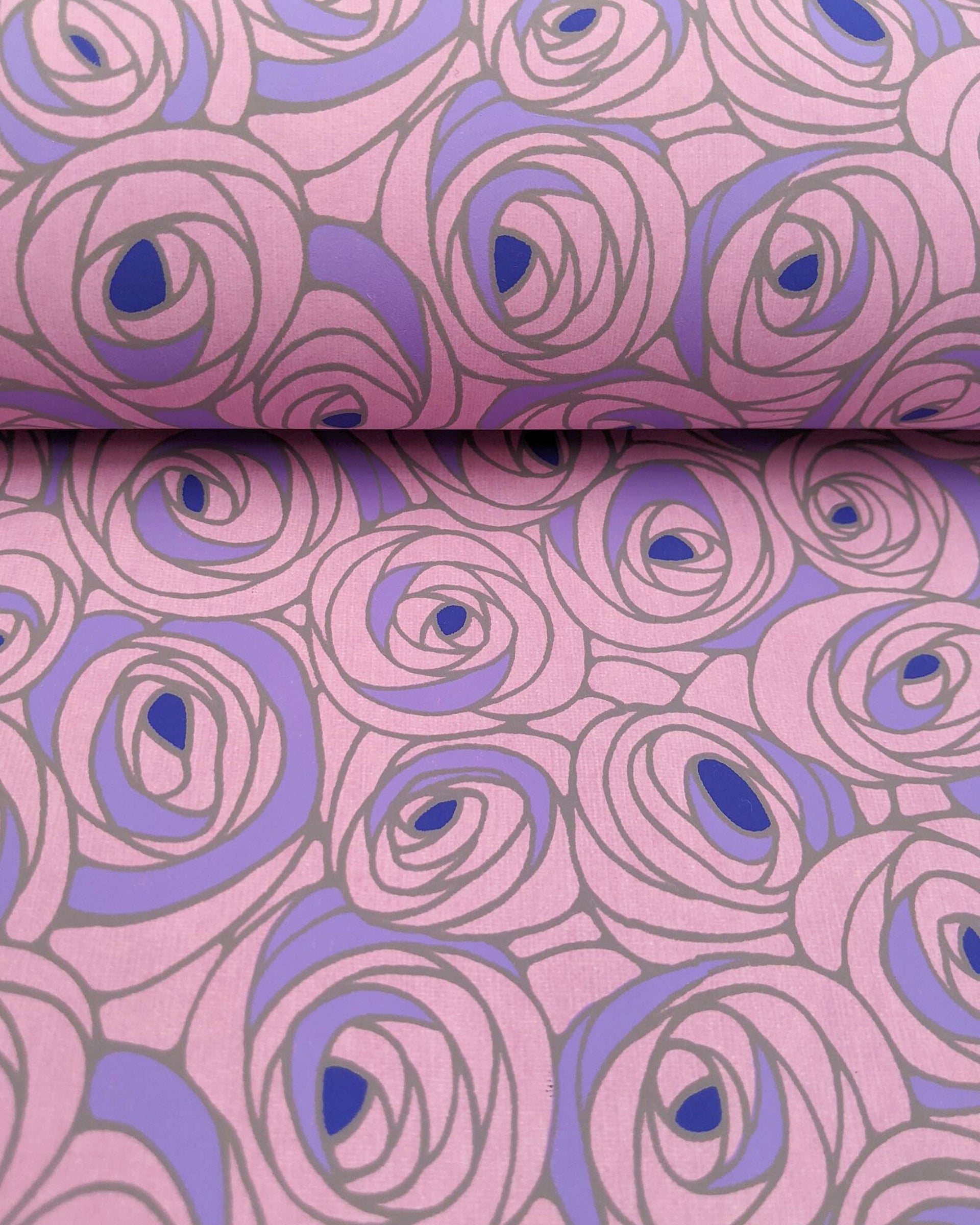 Japanese chiyogami paper featuring large purple rose buds with a dark blue center. 