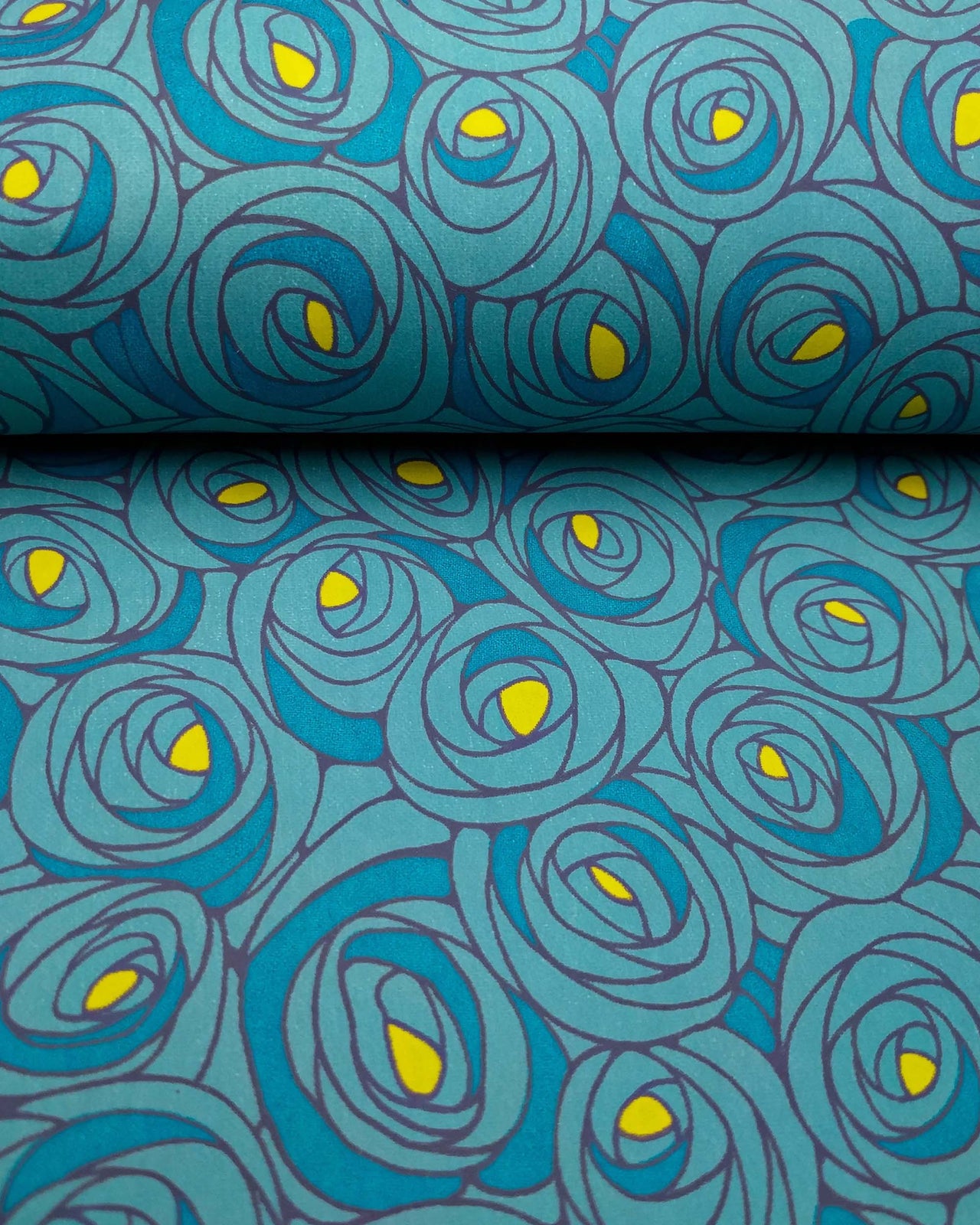 Japanese chiyogami paper featuring large blue rose buds with a yellow center. 