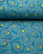Japanese chiyogami paper featuring large blue rose buds with a yellow center. 