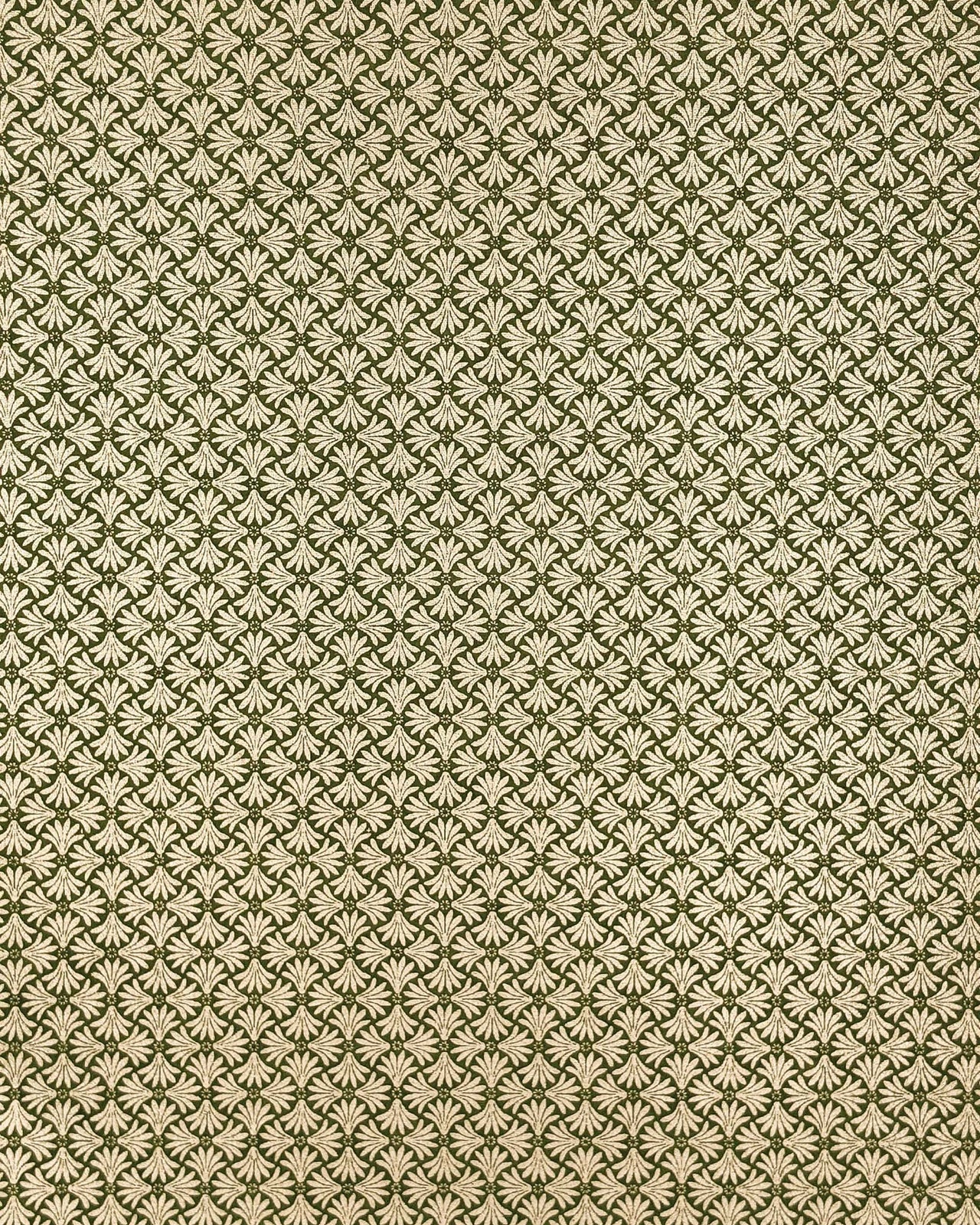 Japanese chiyogami paper featuring metallic gold geometric stylized flowers on a green background.