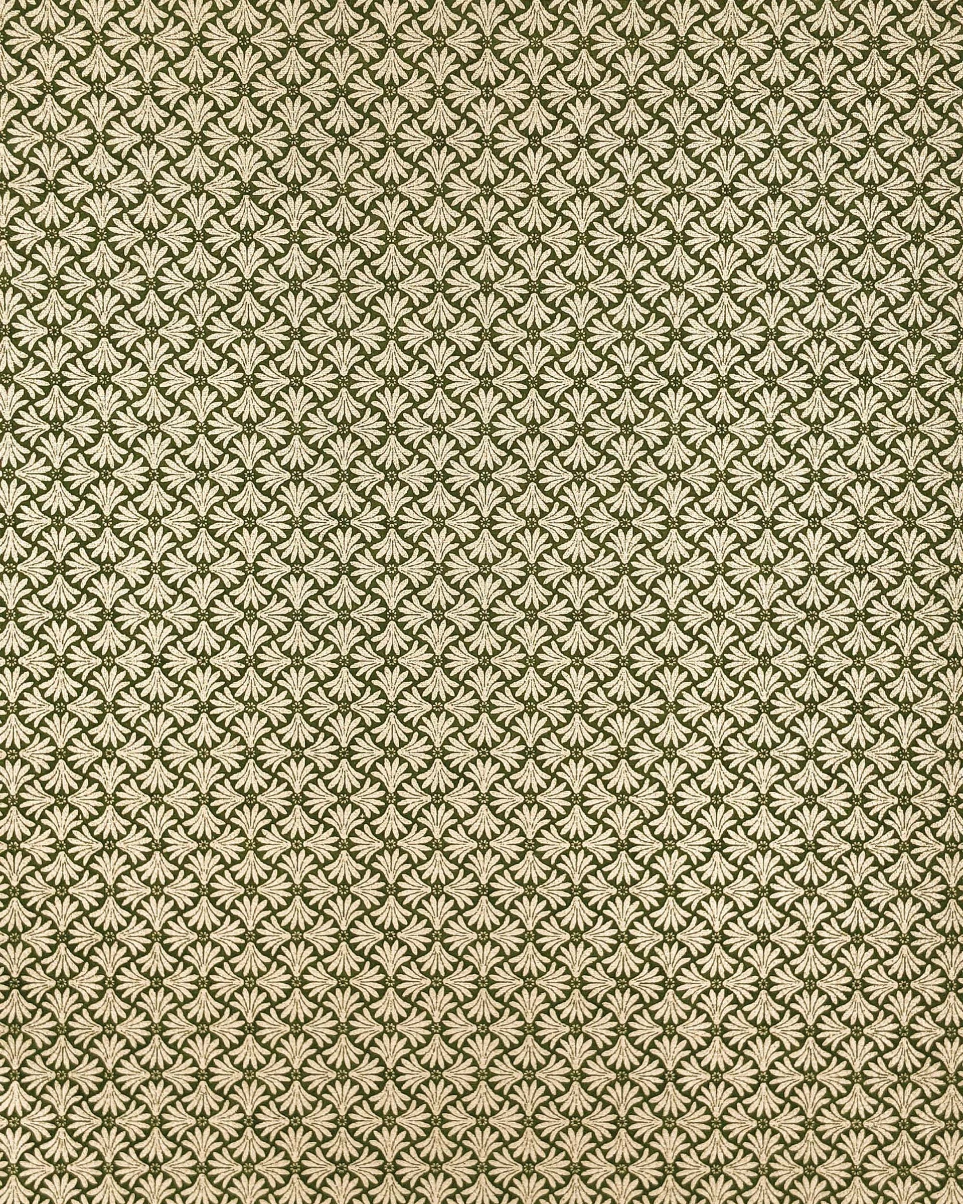 Japanese chiyogami paper featuring metallic gold geometric stylized flowers on a green background.