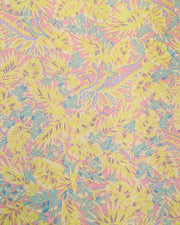 Japanese chiyogami paper featuring yellow, purple, and turquoise frond leaves on a light pink background with metallic gold accents.