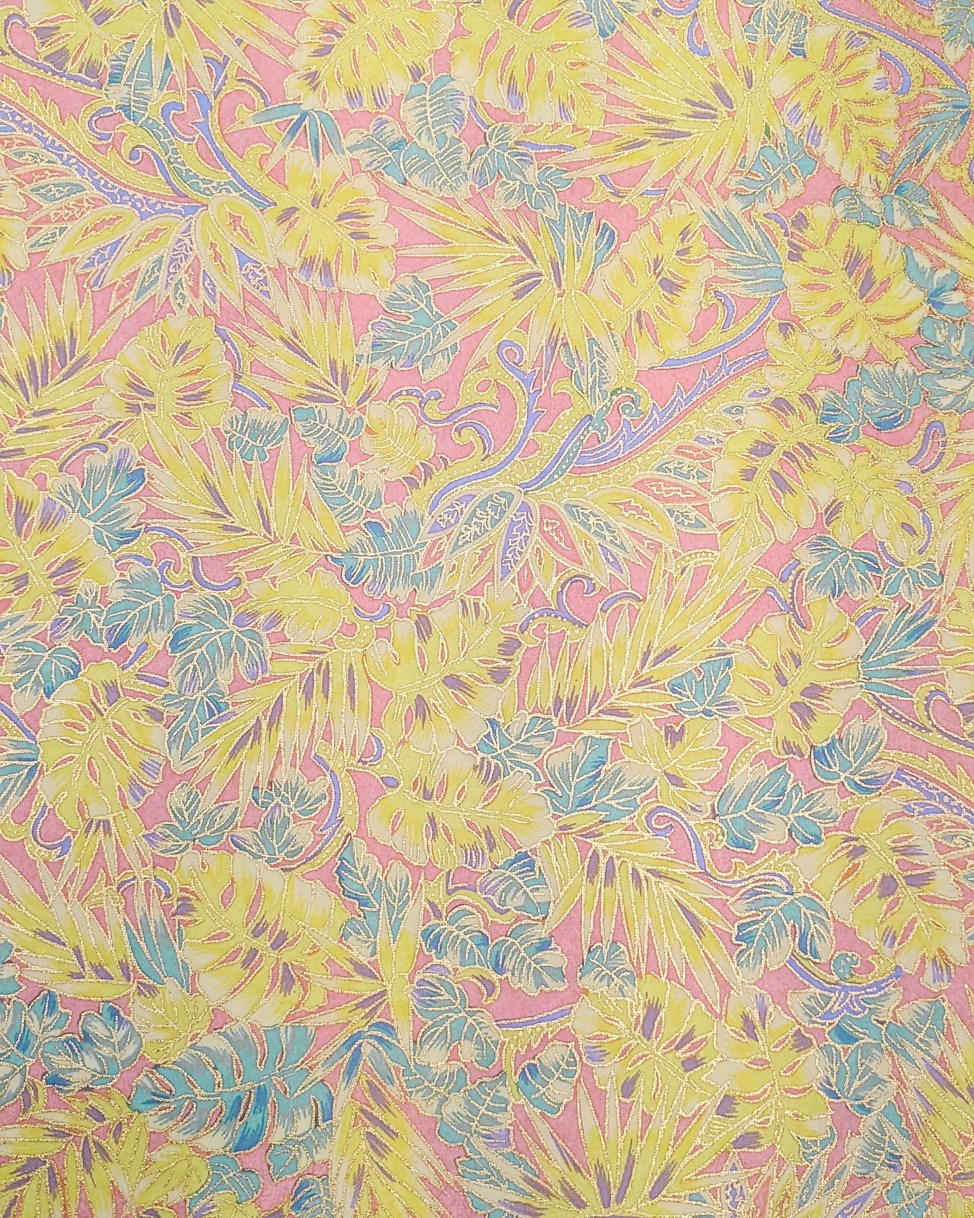 Japanese chiyogami paper featuring yellow, purple, and turquoise frond leaves on a light pink background with metallic gold accents.