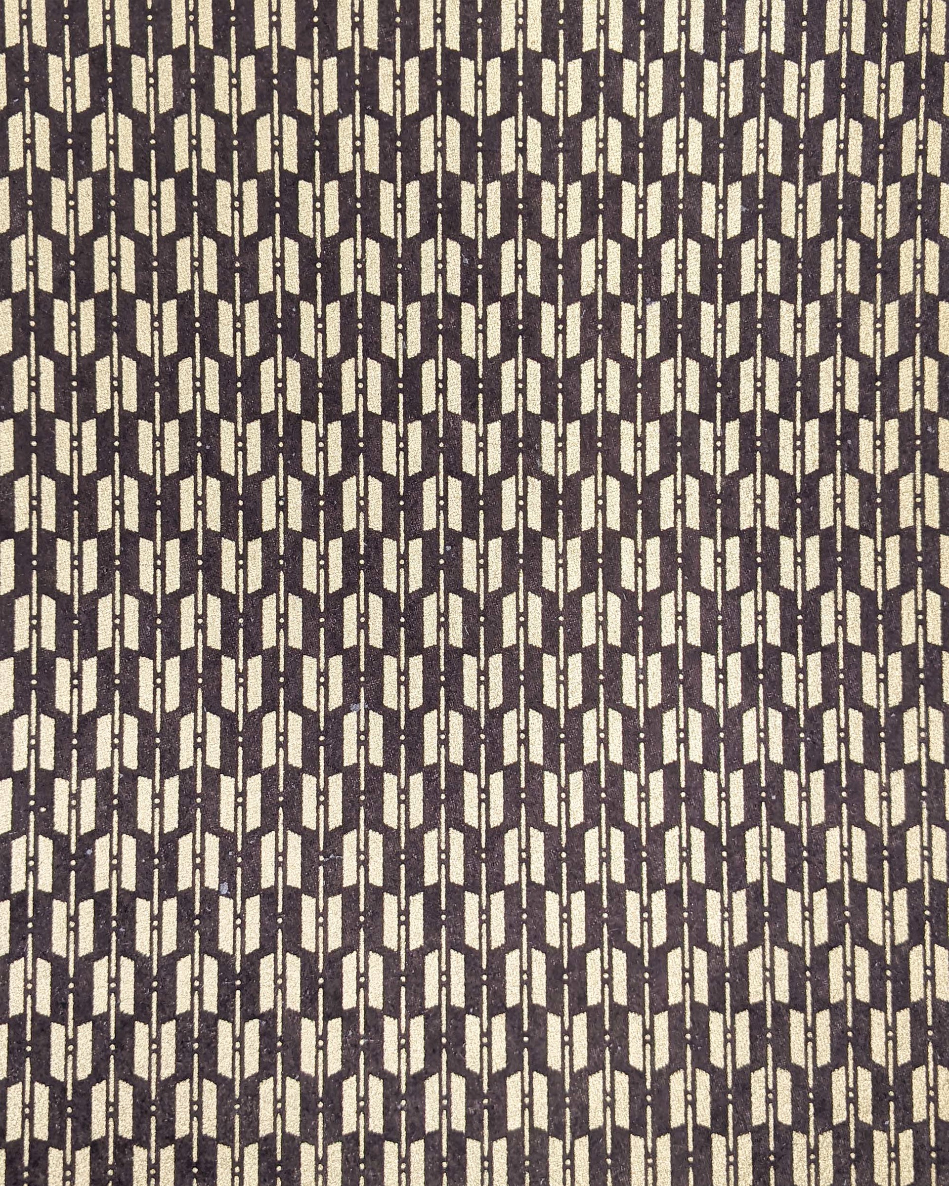 Japanese chiyogami paper featuringa traditional metallic gold yagasuri (arrow fletching) pattern on a gray background. 