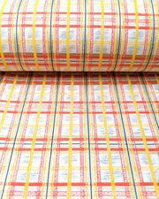 Japanese chiyogami paper featuring a red and yellow koushi (lattice) pattern with metallic gold details on a white background, shown rolled to highlight the design.