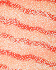 Japanese chiyogami paper featuring small white and metallic gold cherry blossoms on a gradient red background.