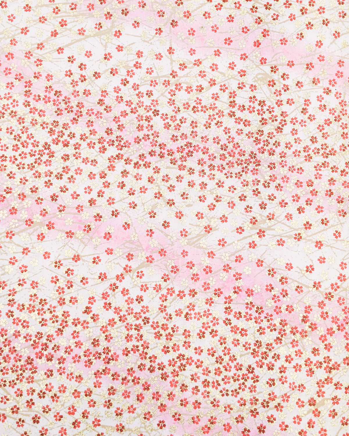 Japanese chiyogami paper featuring small red and metallic gold cherry blossoms on a gradient light pink background.