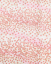 Japanese chiyogami paper featuring small red and metallic gold cherry blossoms on a gradient light pink background.