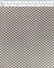 Japanese chiyogami paper featuring a traditional oval shippo pattern in metallic gold with four white dots in the center on a black background, shown next to a ruler for size reference.