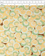 Japanese chiyogami paper featuring beige, turquoise, and light blue overlapping parasols on a brown background with metallic gold details, shown next to a ruler for size reference.