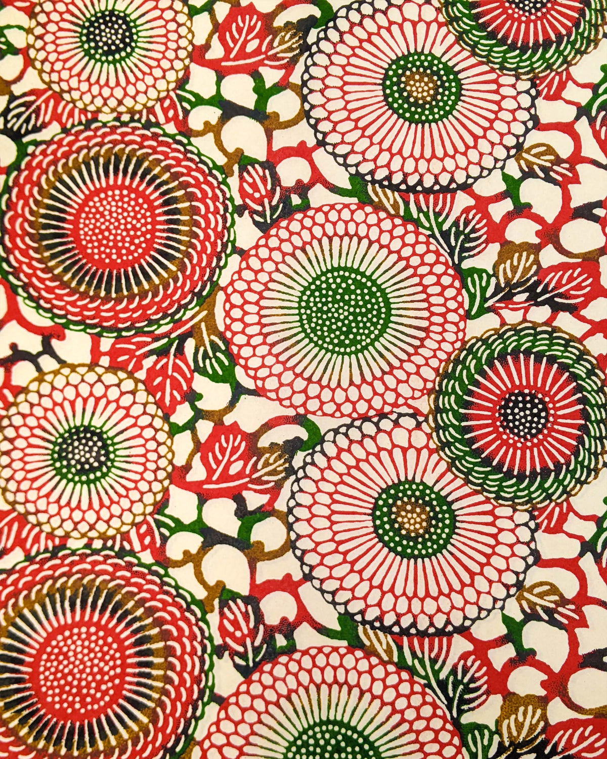 Japanese chiyogami paper featuring large red and green zinnia flowers on a cream background.