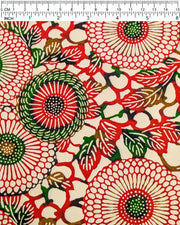 Japanese chiyogami paper featuring large red and green zinnia flowers on a cream background, shown next to a ruler for size reference.